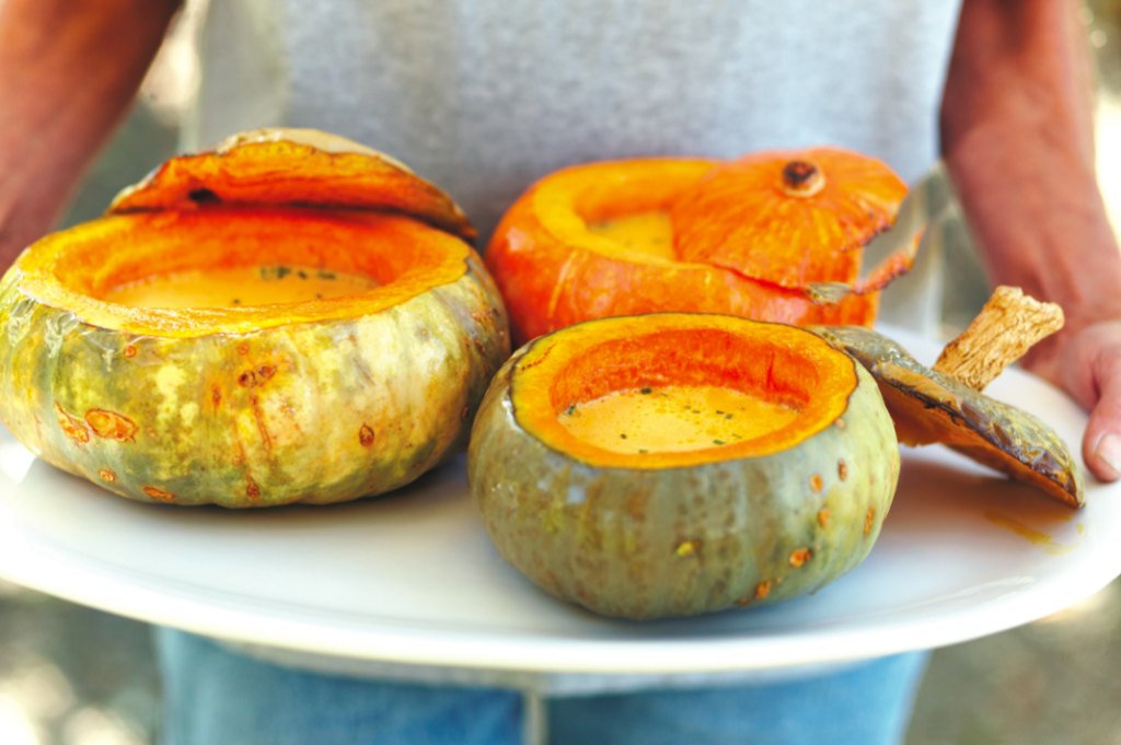 Holding Mustard Grill's famous pumpkin soup