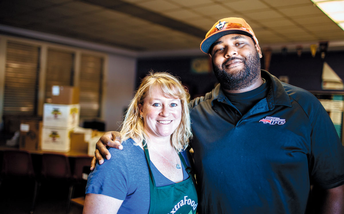 Amy Phillips, a volunteer with Extra Food, and Franklin Smith, the director of the after-school program at Davidson